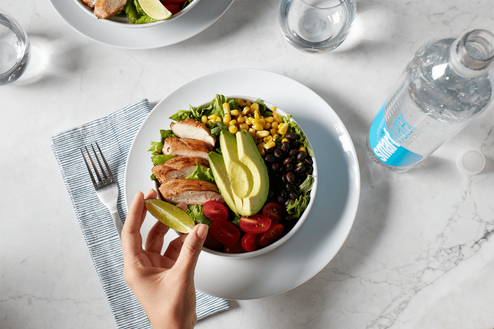 squeezing lime on chicken salad photo