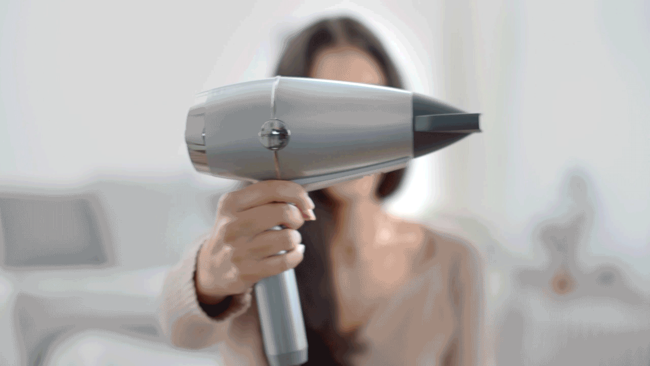person using Conair dryer