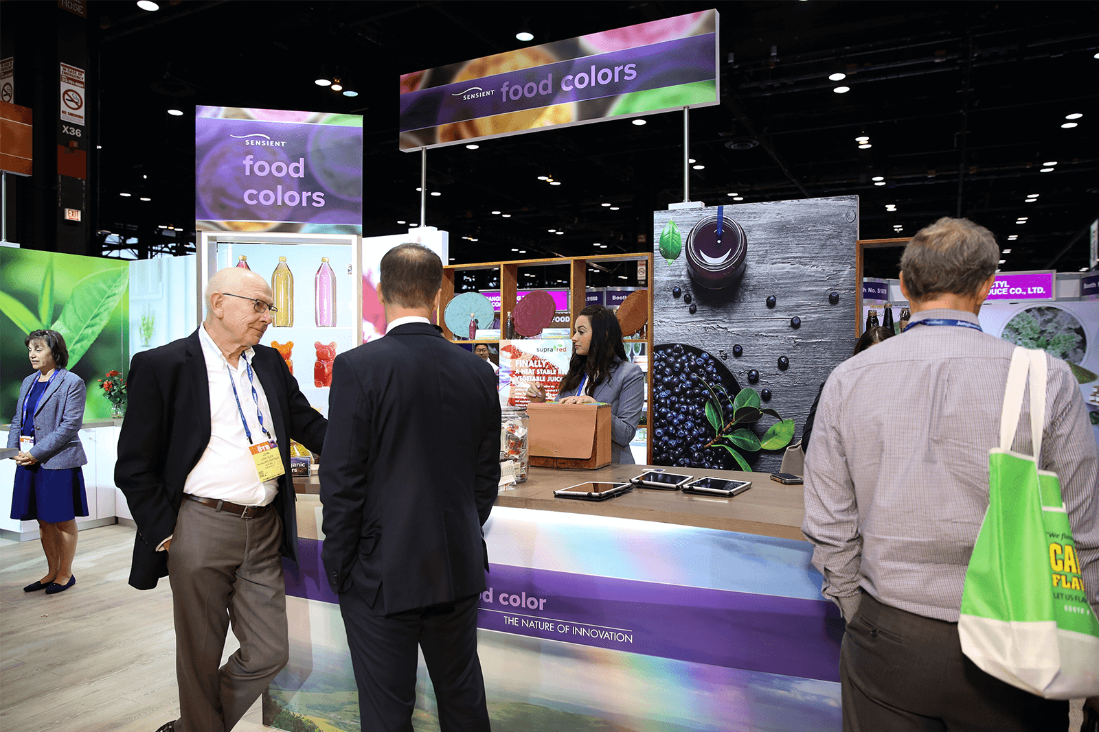 Sensient trade show: guests at sample table